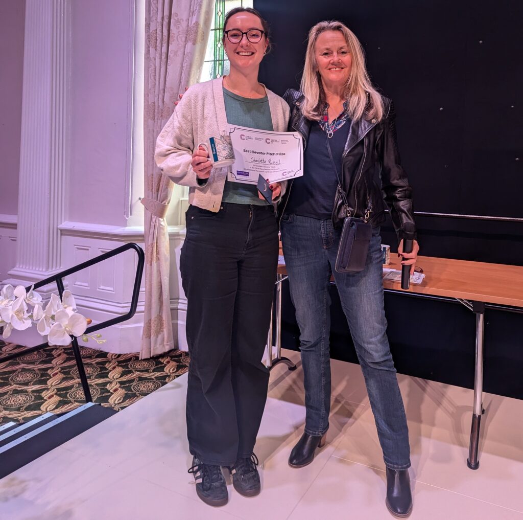 Charlotte Russell presented with an award from Caroline Dive