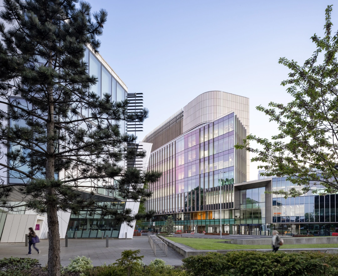 Photograph of the Paterson Building (right) and Oglesby Cancer Research Centre (left) taken at sunset