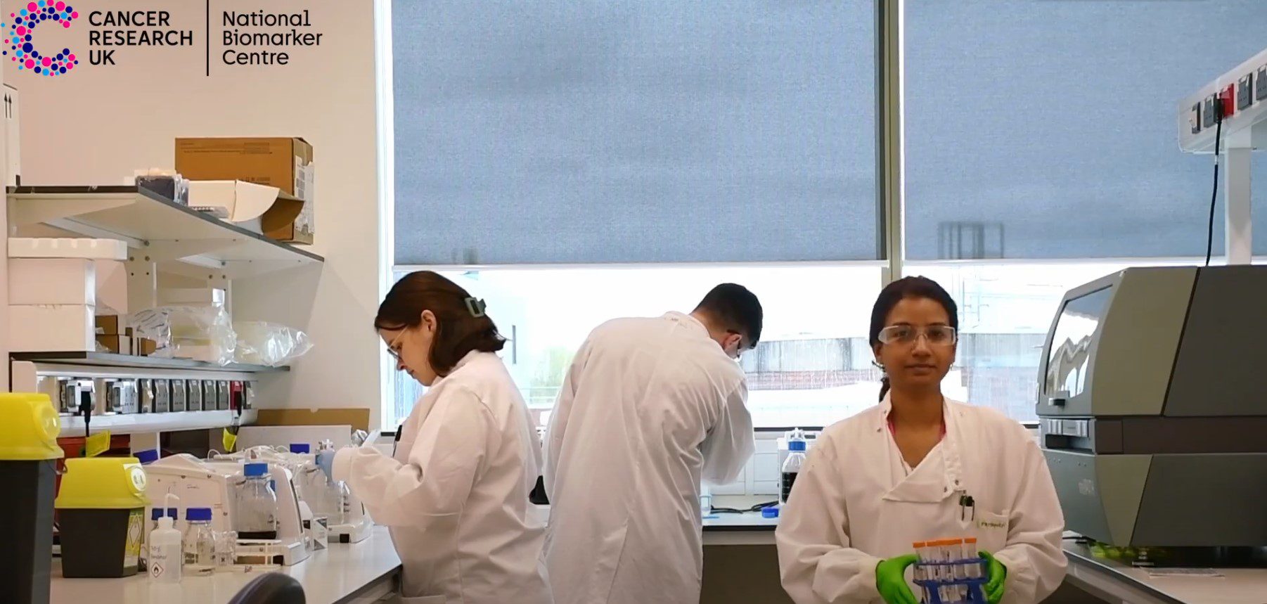 Three researchers working in the National Biomarker Centre laboratories